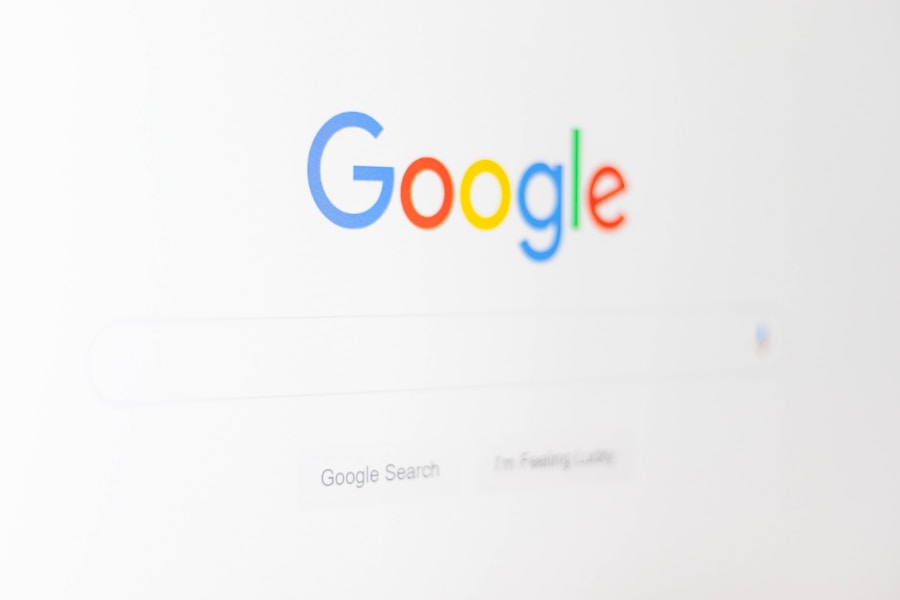 A close-up of a computer screen displaying the Google homepage, with the Google logo above an empty search bar and two search buttons below it—perfect for searching topics like WordPress Hosting.